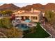 Resort-style backyard with pool, spa, covered patio, seating, and mountain views at 12026 N 138Th St, Scottsdale, AZ 85259