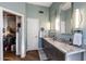 Elegant bathroom with dual sinks, granite countertops, and a walk-in closet for ample storage space at 12026 N 138Th St, Scottsdale, AZ 85259