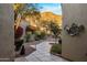 Landscaped courtyard with desert plants and stone pathway leading to the home at 12026 N 138Th St, Scottsdale, AZ 85259