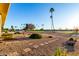 Landscaped backyard with desert plants, stepping stones, and views of the community golf course at 12539 W Paintbrush Dr, Sun City West, AZ 85375