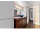 Bathroom features a vessel sink, granite countertop, and modern lighting fixtures at 12539 W Paintbrush Dr, Sun City West, AZ 85375