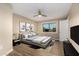 Comfortable bedroom featuring neutral colors, wood floors, and a ceiling fan at 12539 W Paintbrush Dr, Sun City West, AZ 85375