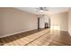 Neutral bedroom highlighting lovely bathroom access and wood-look floors at 12539 W Paintbrush Dr, Sun City West, AZ 85375