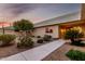 Quaint home with desert landscaping, sidewalk, citrus tree and front door at 12539 W Paintbrush Dr, Sun City West, AZ 85375