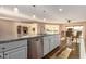 Open-concept kitchen with stainless steel dishwasher, granite countertops, and view of the dining room at 12539 W Paintbrush Dr, Sun City West, AZ 85375