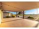 Covered patio features stylish lighting and views of the lush golf course at 12539 W Paintbrush Dr, Sun City West, AZ 85375