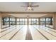 Bright sun room with tile floors, ceiling fans, and expansive views of the golf course at 12539 W Paintbrush Dr, Sun City West, AZ 85375