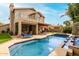 Spacious backyard with a refreshing pool, spa, and covered patio for entertaining or relaxing at 13566 N 93Rd Pl, Scottsdale, AZ 85260