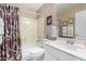 Bathroom featuring a shower/tub combo with a white vanity and framed mirror at 13566 N 93Rd Pl, Scottsdale, AZ 85260