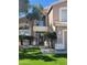 Inviting front entrance with manicured landscaping and a secure gated entry for added privacy at 13566 N 93Rd Pl, Scottsdale, AZ 85260