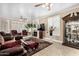 Living room area featuring a fireplace, plush furniture, and neutral color palette at 13566 N 93Rd Pl, Scottsdale, AZ 85260