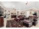 Living room with tile flooring, comfortable seating, and views into the kitchen at 13566 N 93Rd Pl, Scottsdale, AZ 85260