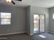 Bright bedroom with a ceiling fan, a window, and sliding glass door at 1367 S Country Club Dr # 1315, Mesa, AZ 85210