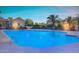 Large pool with relaxing water features, palm trees, and plenty of space for swimming at 1367 S Country Club Dr # 1315, Mesa, AZ 85210