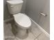 Close-up of a standard toilet in a bathroom with light tile flooring at 1367 S Country Club Dr # 1315, Mesa, AZ 85210