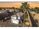 A high angle view of a well maintained home with a backyard palm tree at 1447 S Portland Ave, Gilbert, AZ 85296