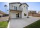 A spacious back patio features concrete flooring and an outdoor balcony at 1447 S Portland Ave, Gilbert, AZ 85296