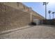 A private backyard area featuring a block fence, a shed, and rock landscaping at 1447 S Portland Ave, Gilbert, AZ 85296