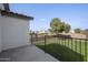 Spacious fenced backyard features lush lawn and open space, perfect for outdoor activities and enjoying the serene environment at 1447 S Portland Ave, Gilbert, AZ 85296