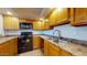 Kitchen featuring wood cabinetry, neutral countertops, and stainless steel sink at 1645 W Baseline Rd # 2050, Mesa, AZ 85202