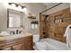 Charming bathroom with tub/shower combo, and ample vanity storage space at 16808 N 59Th Pl, Scottsdale, AZ 85254