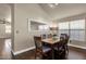 Dining area boasts a wooden table with seating for six, a large mirror, and natural light at 16808 N 59Th Pl, Scottsdale, AZ 85254