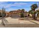 Charming single-story home featuring desert landscaping, a tile roof, and a two-car garage at 16808 N 59Th Pl, Scottsdale, AZ 85254