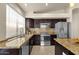 Well-lit kitchen featuring stainless steel appliances and granite countertops at 16808 N 59Th Pl, Scottsdale, AZ 85254