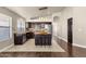 Modern kitchen with an island, barstool seating, and stainless steel appliances at 16808 N 59Th Pl, Scottsdale, AZ 85254