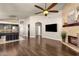 Open concept, view of kitchen from living room with stone fireplace at 16808 N 59Th Pl, Scottsdale, AZ 85254