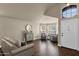 Bright living room featuring hardwood floors, large windows, and stylish furnishings at 16808 N 59Th Pl, Scottsdale, AZ 85254