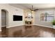 Spacious living room featuring a stone fireplace and hardwood floors at 16808 N 59Th Pl, Scottsdale, AZ 85254