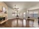 Living room featuring stone fireplace, hardwood floors, and neutral paint at 16808 N 59Th Pl, Scottsdale, AZ 85254