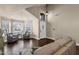 Inviting living room with gleaming hardwood floors, large windows, and comfortable sofa at 16808 N 59Th Pl, Scottsdale, AZ 85254