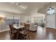 An open-concept design joins a dining area with a living room with large bright windows at 16808 N 59Th Pl, Scottsdale, AZ 85254