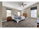 Comfortable main bedroom featuring a ceiling fan and natural lighting at 16808 N 59Th Pl, Scottsdale, AZ 85254