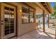 Inviting covered patio overlooks the pool and backyard area at 16808 N 59Th Pl, Scottsdale, AZ 85254