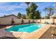 Backyard with private pool, surrounded by desert landscaping and a privacy wall at 16808 N 59Th Pl, Scottsdale, AZ 85254