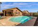 Backyard pool view, with tan concrete and landscaping, adjacent to patio and home at 16808 N 59Th Pl, Scottsdale, AZ 85254