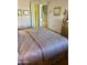 Inviting bedroom with neutral colors and a view towards the closet and arched doorway to another room at 17012 S 27Th Ln, Phoenix, AZ 85045