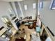 Open living space with a fireplace, clerestory windows, neutral tile flooring, and a ceiling fan at 17012 S 27Th Ln, Phoenix, AZ 85045