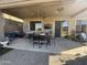 Comfortable patio with a ceiling fan, outdoor furniture, and a view of the landscaped backyard, ideal for entertaining at 17012 S 27Th Ln, Phoenix, AZ 85045