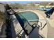 Stunning pool with a rock waterfall feature, privacy fence, and a lush garden, perfect for outdoor living at 17012 S 27Th Ln, Phoenix, AZ 85045