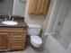 Bathroom featuring a wooden vanity, tile floor, and shower-tub combo at 17019 N Pinion Ln, Sun City, AZ 85373