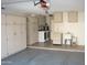 Garage space featuring storage cabinets, laundry machines, and a utility sink at 17019 N Pinion Ln, Sun City, AZ 85373