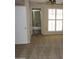 Carpeted main bedroom featuring neutral walls, a window with shutters, and an en-suite bathroom at 17019 N Pinion Ln, Sun City, AZ 85373