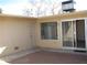 Private patio area with a sliding glass door entry at 17019 N Pinion Ln, Sun City, AZ 85373