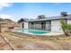 View of backyard with in-ground swimming pool and rock landscaping at 1730 W Pershing Ave, Phoenix, AZ 85029