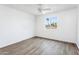 Well-lit bedroom featuring wood-look floors and a ceiling fan at 1730 W Pershing Ave, Phoenix, AZ 85029