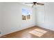 Small bedroom features neutral walls and wood-look floors at 1730 W Pershing Ave, Phoenix, AZ 85029